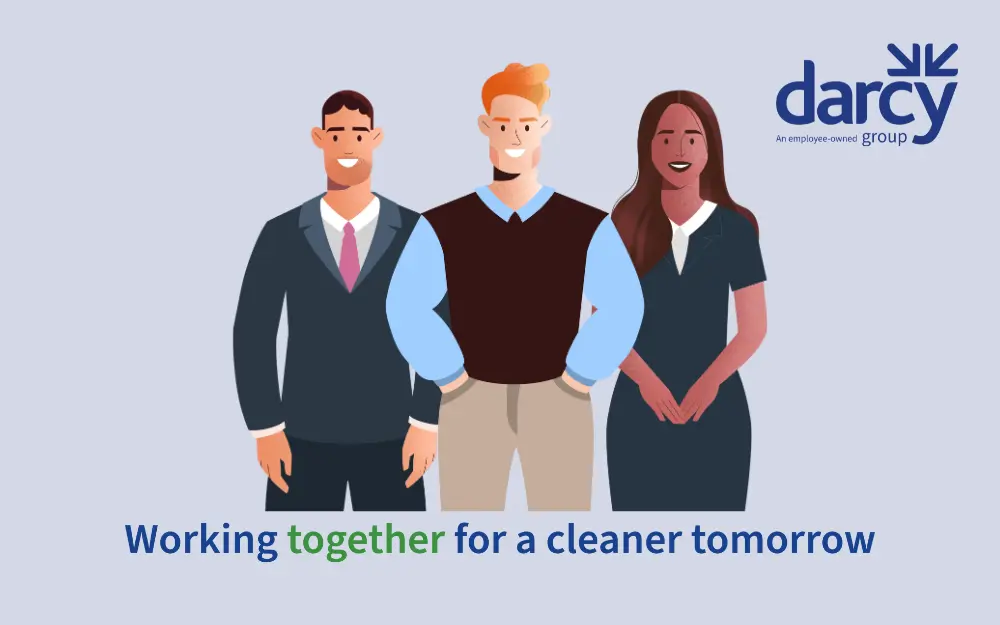 Three employees standing together with the text underneath 'Working together for a cleaner tomorrow', Darcy Group logo in the top corner