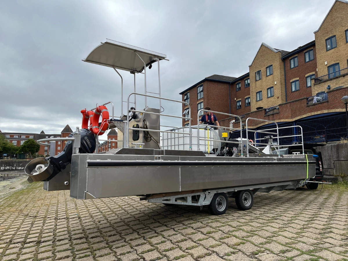 Oil recovery vessel on trailer showing outboard